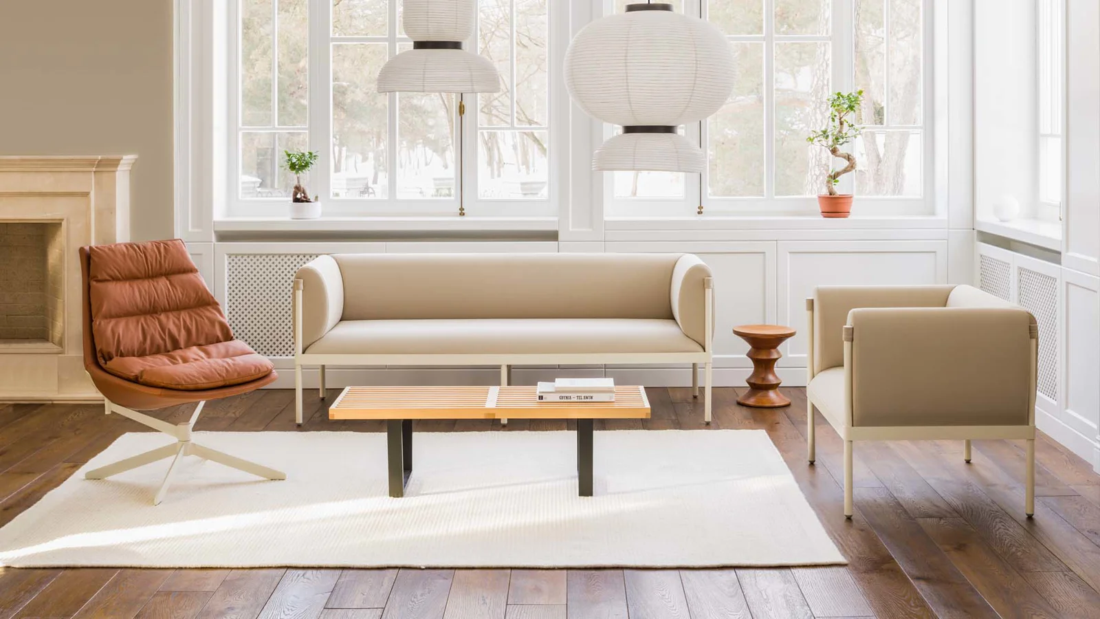 MDD Stilt sofa and armchair with a Fat Frank lounge chair in a bright interior