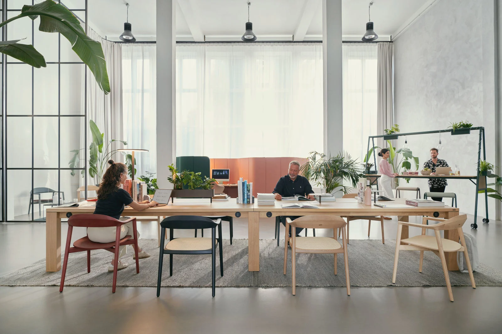 Sedus se:café team tables and chairs in a bright shared workplace