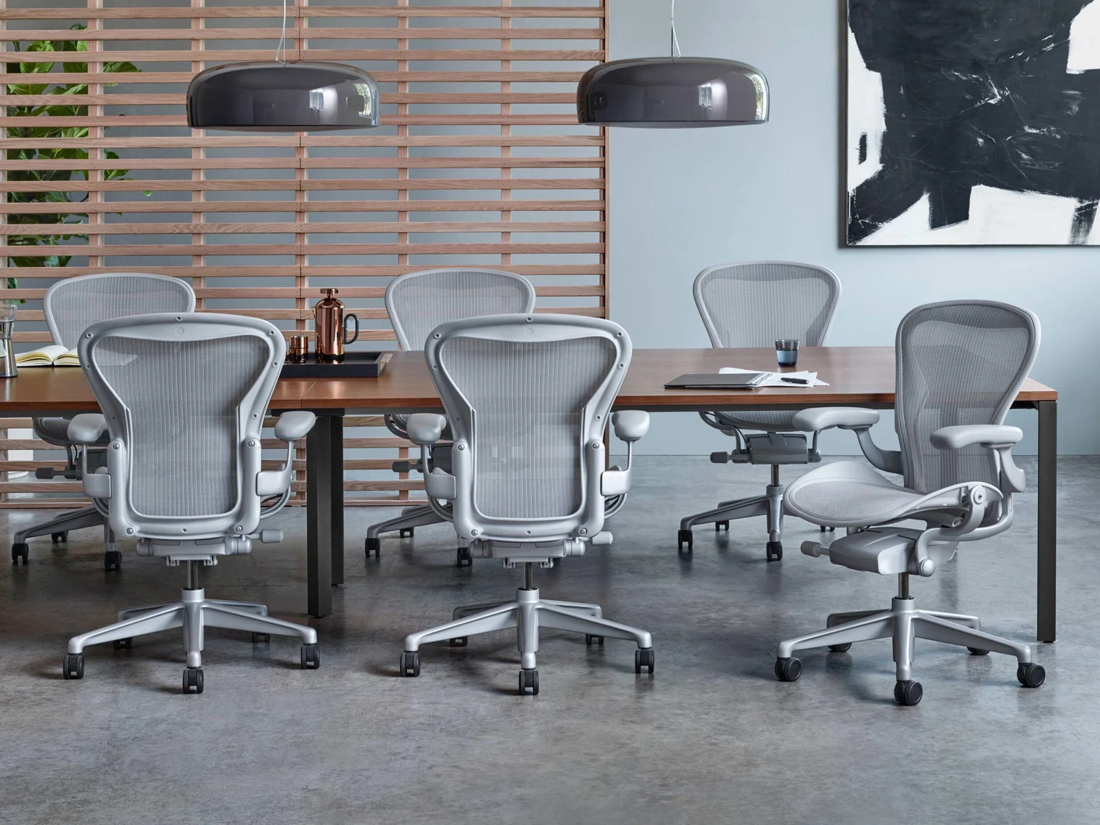Herman Miller Aeron chairs arranged around a table in a studio setting